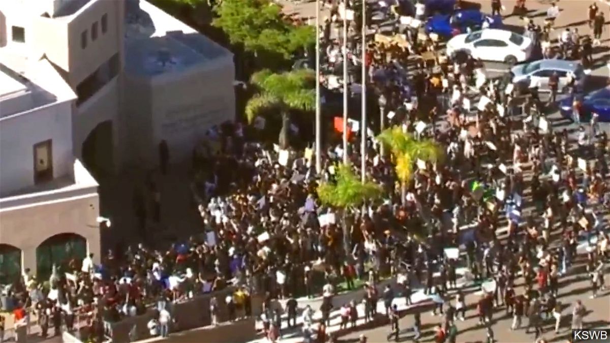 Protesters gather around the La Mesa police precinct in San Diego, California Saturday