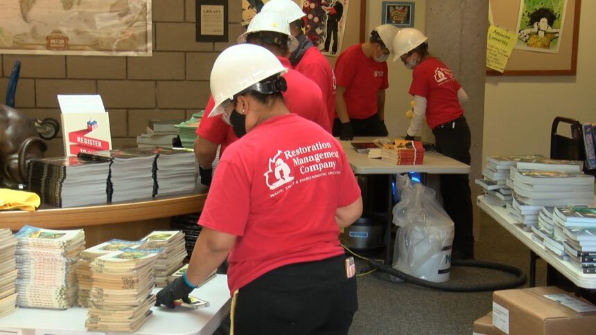 Crews clean-up inside the San Lorenzo Valley School Library