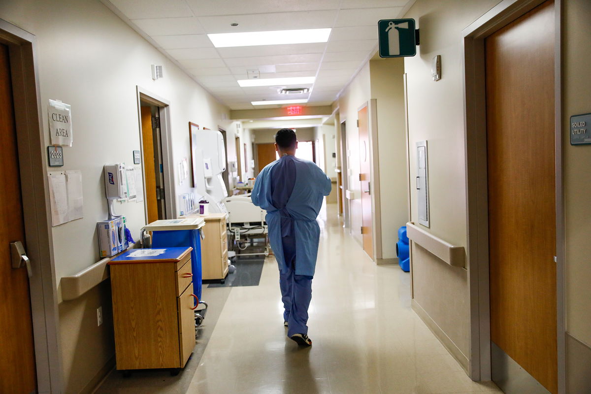 SAN JOSE. CA - DEC. 8: Nurse Nestor Cardenas walks down the hall as he treats COVID-19 patients at Regional Medical Center of San Jose, an acute-care hospital, on Tuesday, Dec. 8, 2020 in San Jose, California. Following Thanksgiving there has been an uptick in COVID-19 cases all over California and the Bay Area. (Gabrielle Lurie/The San Francisco Chronicle via Getty Images)