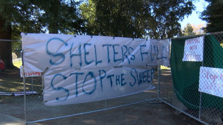 Stop the sweeps sign at San Lorenzo Park