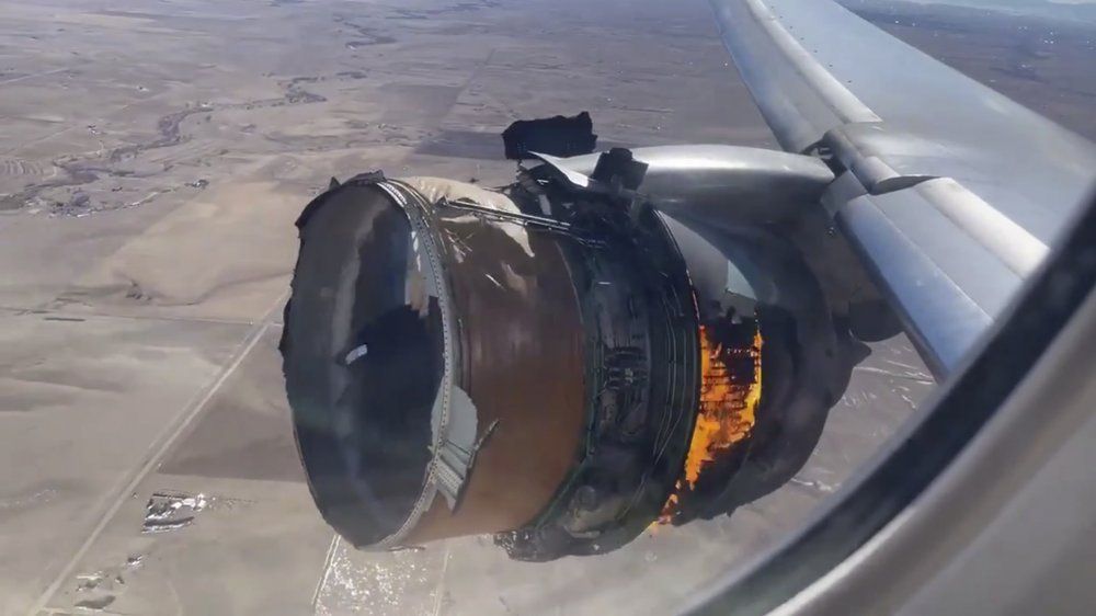 In this image taken from video, the engine of United Airlines Flight 328 is on fire after after experiencing 