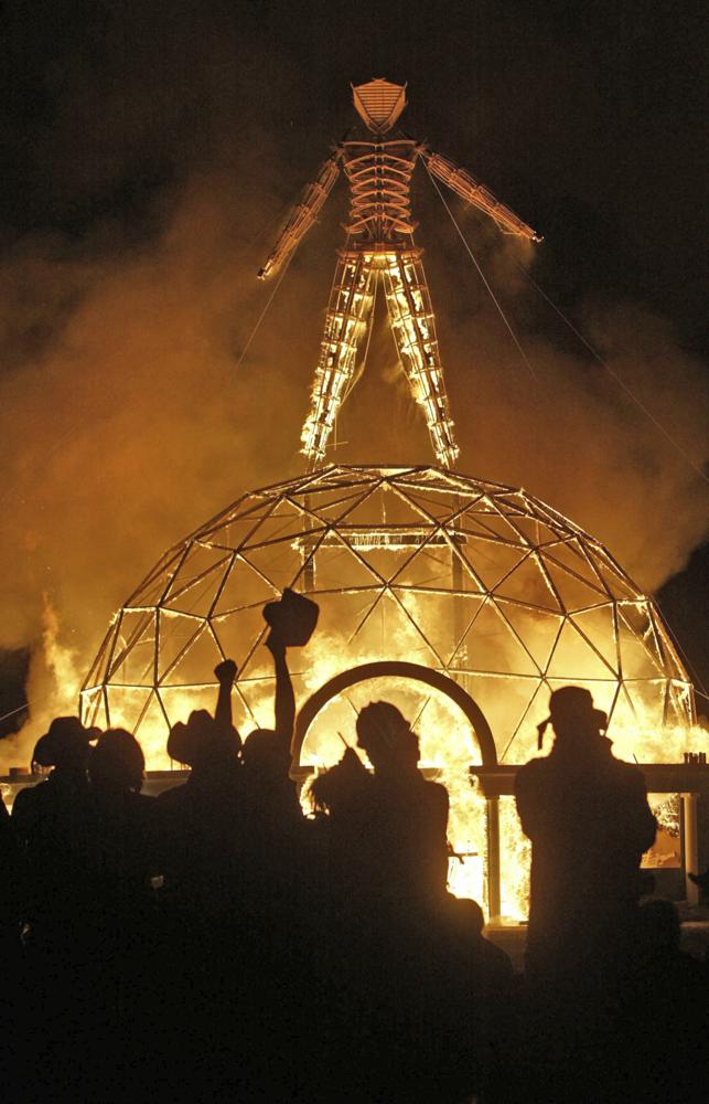 FILE - In this Sept. 4, 2004 file photo the crowd of thousands cheer as the Burning Man is burned.