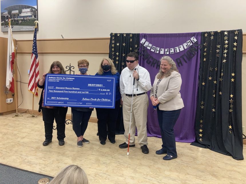 Giovanni Rocco Romeo receiving his scholarship at MCOE.