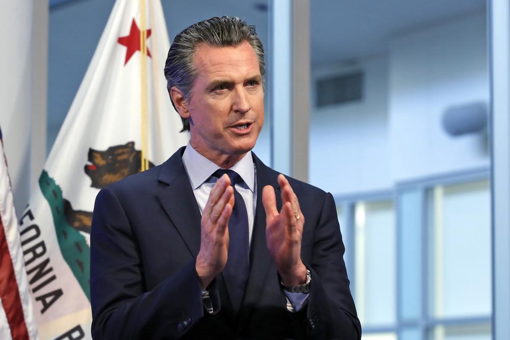 FILE - In this April 14, 2020, file photo, California Gov. Gavin Newsom discusses an outline for what it will take to lift coronavirus restrictions during a news conference at the Governor's Office of Emergency Services in Rancho Cordova, While California will end most coronavirus rules on June 15, Gov. Gavin Newsom said Friday, June 4, 2021 he will not lift the “state of emergency” that has been in place since March 2020.