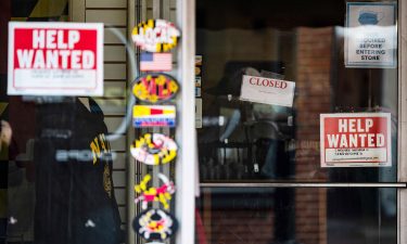 A store advertises a Help Wanted sign in Annapolis