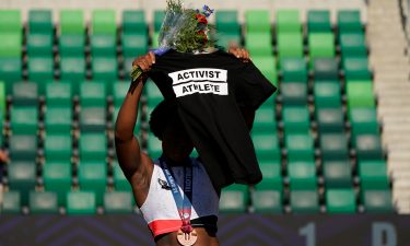 Gwendolyn Berry (left) stands on the podium having placed third in the hammer throw final at the US Olympic trials.