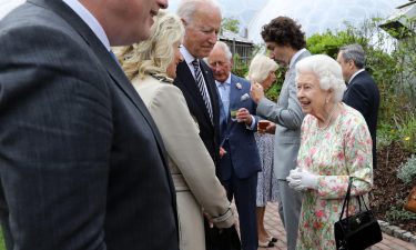 Britain's Queen Elizabeth II speaks with US President Joe Biden and US First Lady Jill Biden and leaders of the G7 during a reception at The Eden Project in south west England on June 11.