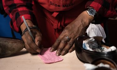 A shoe cobbler working in a black-owned business in Washington