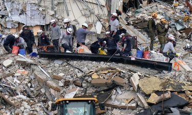 Rescue workers search in the rubble at the Champlain Towers South condominium on June 30 in the Surfside area of Miami.
