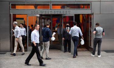 People enter the Goldman Sachs headquarters building in New York on Monday