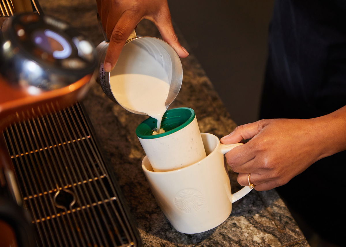 The new contactless system is shown in action at a Starbucks.