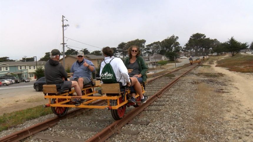 Residents take cruise on train tracks with unique handcars