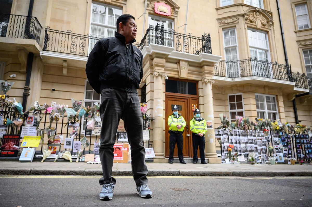 <i>Leon Neal/Getty Images</i><br/>Former Myanmar Ambassador to the UK Kyaw Zwar Minn listens to a statement being read on his behalf as he stands outside the Myanmar Embassy on April 8 in London