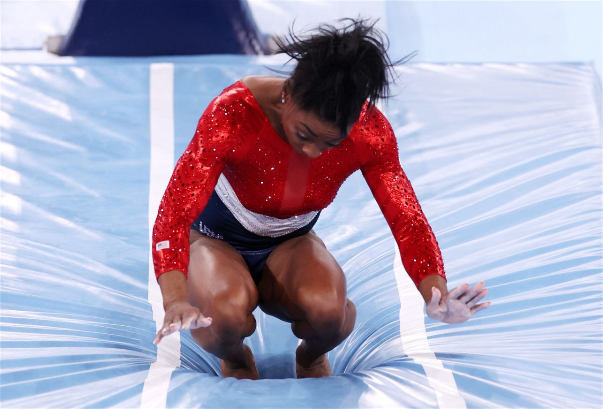 <i>Jamie Squire/Getty Images</i><br/>Simone Biles of Team United States stumbles upon landing after competing in vault during the women's team final on day four of the Tokyo 2020 Olympic Games at Ariake Gymnastics Centre.