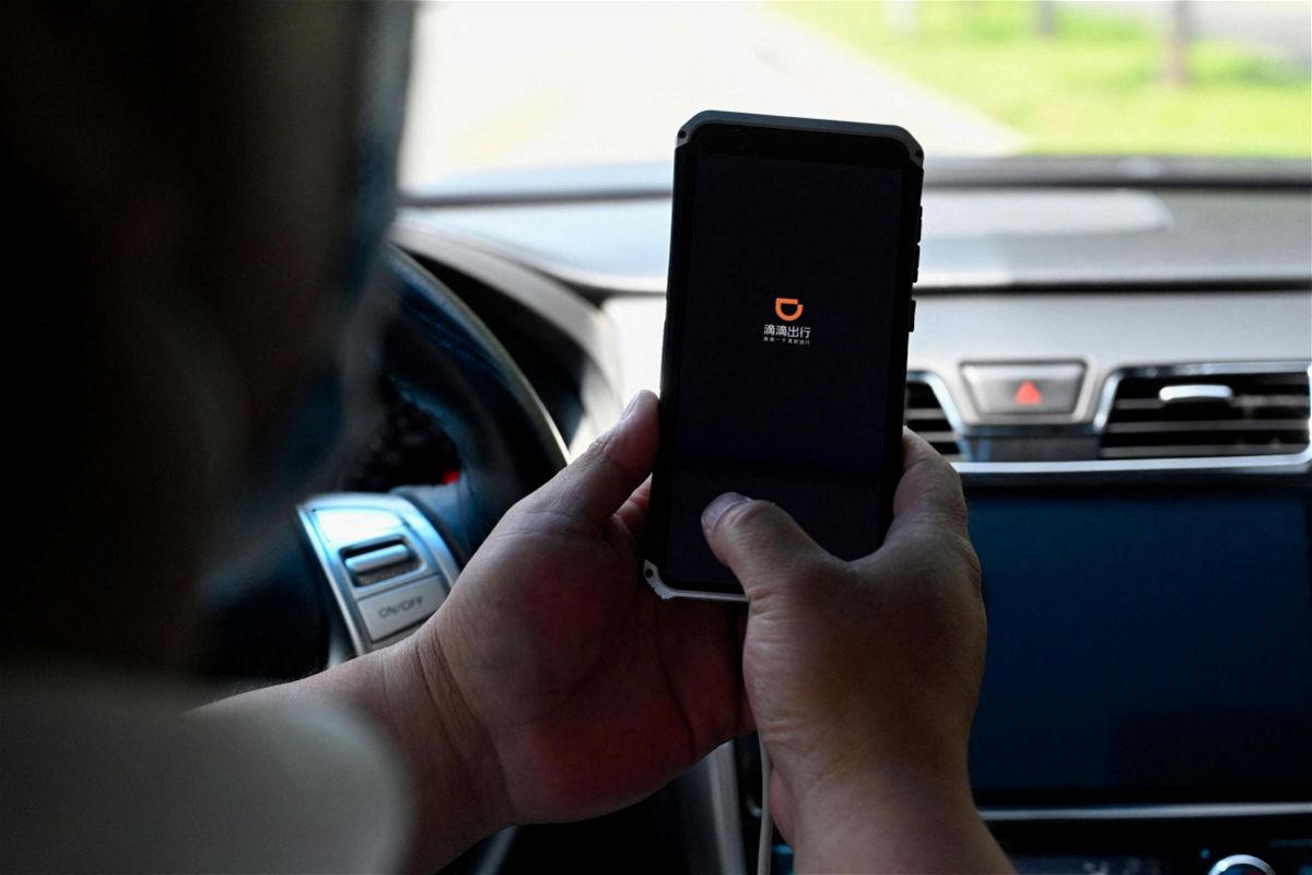 <i>Jade Gao/AFP/Getty Images</i><br/>A driver opens the Didi Chuxing ride-hailing app on his smartphone in Beijing on July 2. The Cyberspace Administration of China on July 4 banned Didi from app stores after saying it posed a cybersecurity risk for customers.