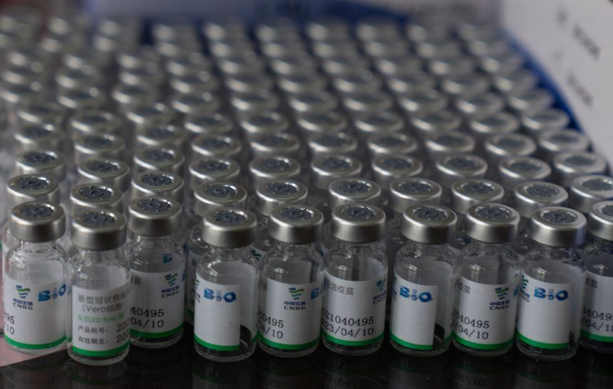 Empty vials of vaccines sit in a tray during a vaccination campaign for people over 40 in La Paz