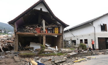 A man stands in front of a destroyed house after floods caused major damage in Schuld near Bad Neuenahr-Ahrweiler