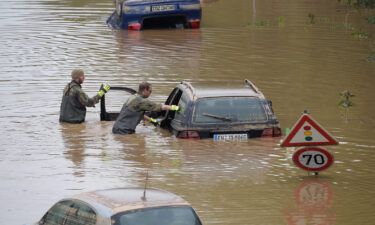Soldiers of the German armed forces Bundeswehr search for flood victims in submerged vehicles on the federal highway B265 in Erftstadt