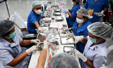 Health workers prepare doses of the CoronaVac vaccine in Bangkok on June 22.