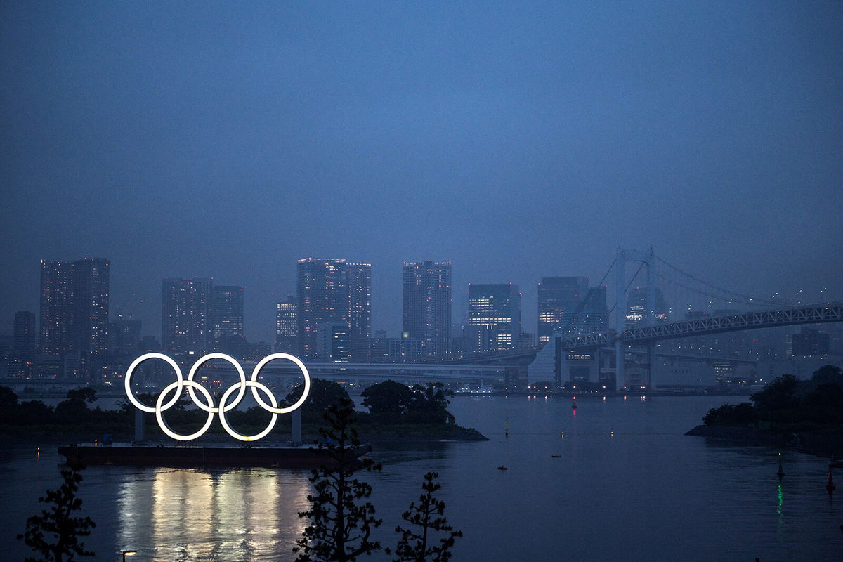 <i>Charly Triballeau/AFP/Getty Images</i><br/>This general view shows the Olympic Rings lit up at dusk on the Odaiba waterfront in Tokyo on July 9