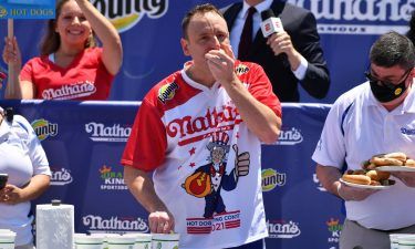 Joey Chestnut beat his own world record to win the hot dog eating contest for a 14th time in 15 years.