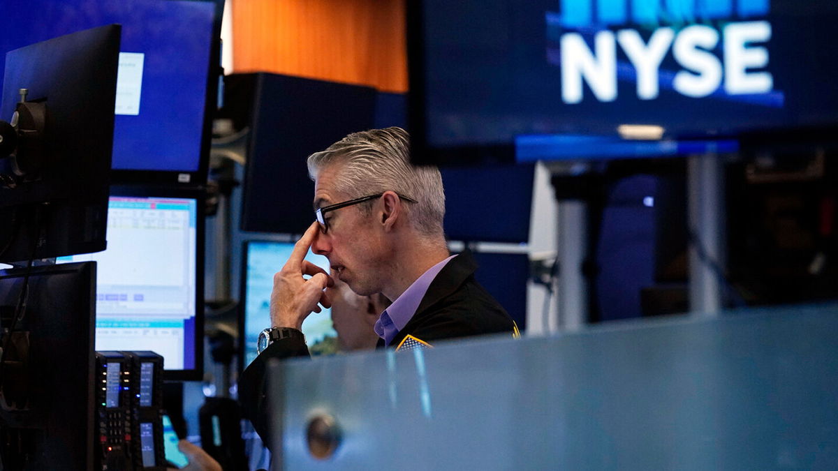 <i>Richard Drew/AP</i><br/>A trader works on the floor of the New York Stock Exchange