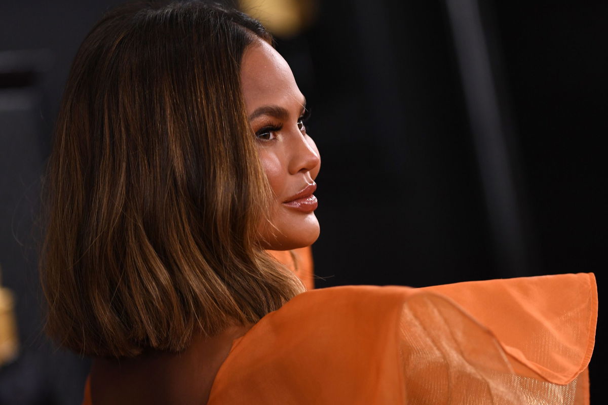 <i>VALERIE MACON/AFP/AFP via Getty Images</i><br/>Chrissy Teigen arrives for the 62nd Annual Grammy Awards on January 26