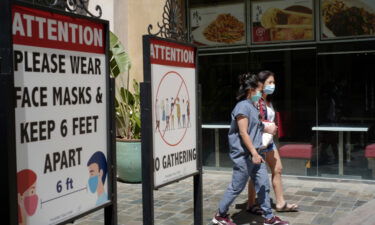 A June 11 photo shows customers at an outdoor mall four days before Los Angeles and California reopened. Los Angeles County