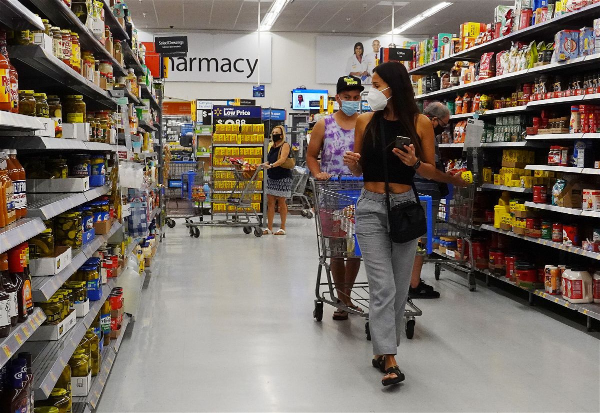 <i>Joe Raedle/Getty Images</i><br/>Walmart employees are required to wear masks inside again