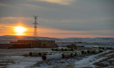 Pipes for the Keystone XL pipeline stacked in a yard near Oyen