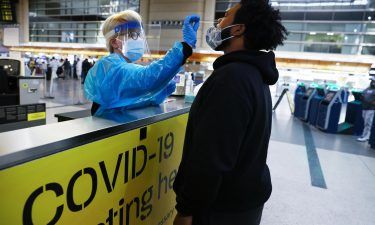 A man receives a Covid-19 test at Los Angeles International Airport amid a coronavirus surge in Southern California on December 22