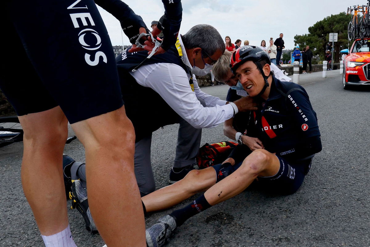 <i>Thomas Samson/AFP/Getty Images</i><br/>Geraint Thomas sits on the road after crashing during the third stage of the 108th edition of the Tour de France cycling race