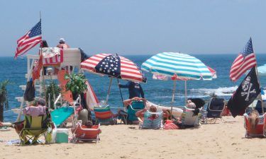 Flags line the beach in Belmar