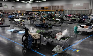 Residents are shown at a cooling center during a heatwave in Portland