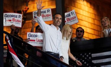 Texas Land Commissioner George P. Bush arrives for a kick-off rally with his wife Amanda to announced he will run for Texas Attorney General