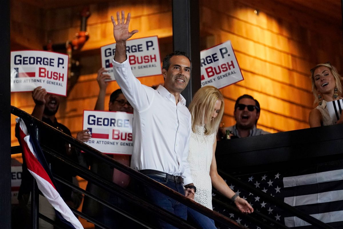 <i>Eric Gay/AP</i><br/>Texas Land Commissioner George P. Bush arrives for a kick-off rally with his wife Amanda to announced he will run for Texas Attorney General