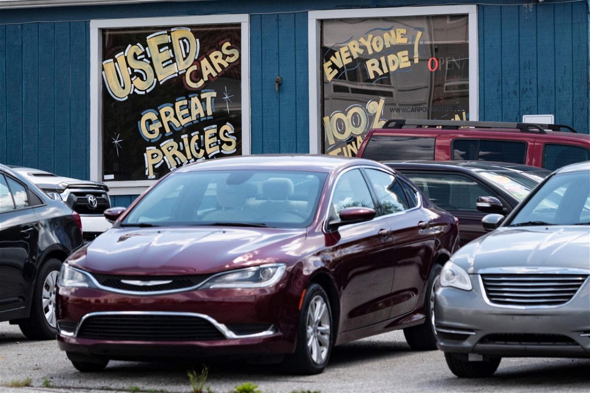 <i>Jim Watson/AFP/Getty Images</i><br/>A used car dealership is seen in Laurel