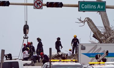 Rescue crews work in the rubble of the collapsed Champlain Towers South condominium building