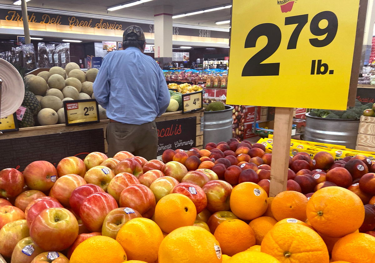 <i>Scott Olson/Getty Images</i><br/>Customers shop for produce at a supermarket on June 10 in Chicago