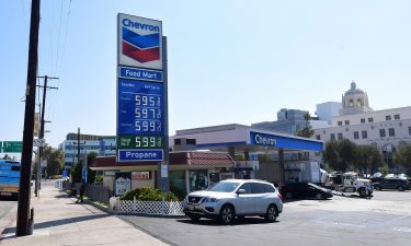 Some of the highest gas prices in town are posted on a signboard at a gas station in downtown Los Angeles