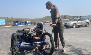 Maggie Gettys (right) was reunited with her adaptive bike on August 29 after it was stolen from her car a day earlier thanks to the help of social media and community members.