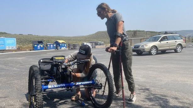 <i>KSL</i><br/>Maggie Gettys (right) was reunited with her adaptive bike on August 29 after it was stolen from her car a day earlier thanks to the help of social media and community members.