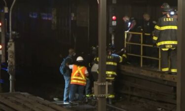 Stranded subway riders in New York had to walk on tracks in order to exit the station following a power outage on August 29.