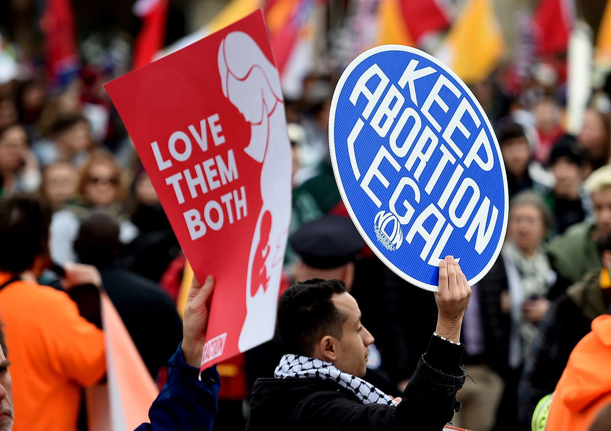 <i>Olivier Douliery/AFP/Getty Images</i><br/>Abortion clinics in Texas asked the Supreme Court Monday to block a controversial law that bans abortions at six weeks. Abortion activists here demonstrate in front of the US Supreme Court in January 2020.