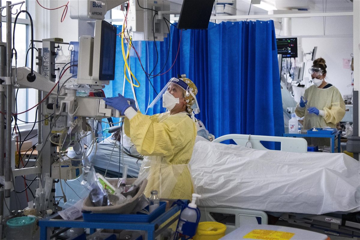 <i>Victoria Jones/PA/AP</i><br/>Nurses care for Covid-19 patients in the Intensive Care Unit in St George's Hospital in Tooting