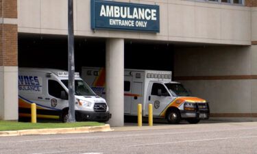 Ambulances wait at a hospital in Montgomery