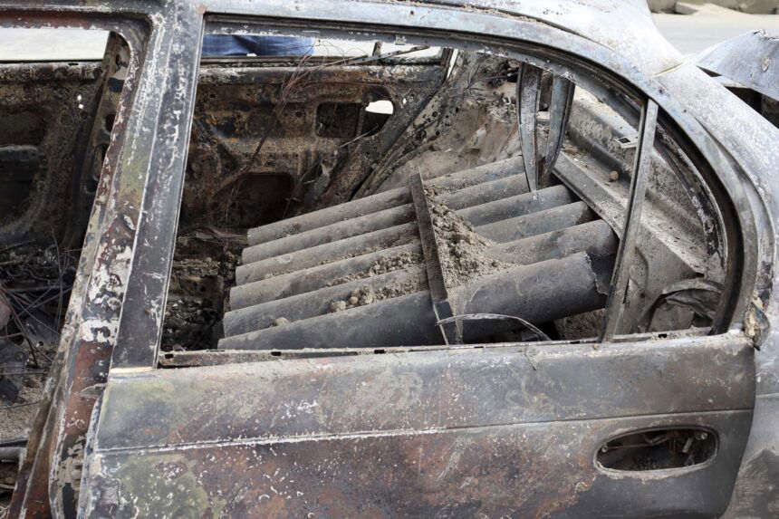 Rocket launcher tubes inside a destroyed vehicle in Kabul