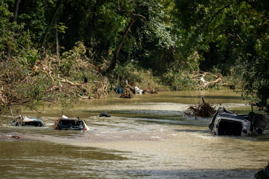 Vehicles are submerged in Trace Creek as a result of severe weather in Waverly.