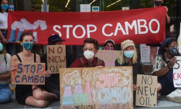 Cambo oilfield protestors rally outside a UK government building in Edinburgh