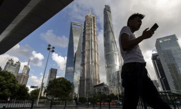 Beijing toughens its regulation of the country's tech companies. A man here walks in Shanghai